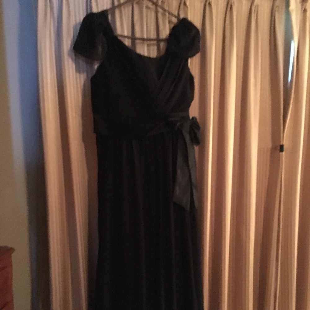 Floor length, empire waist black formal gown.